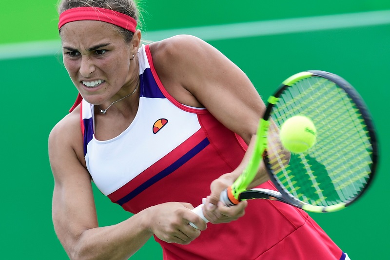 Monica Puig in mezzo alle giganti